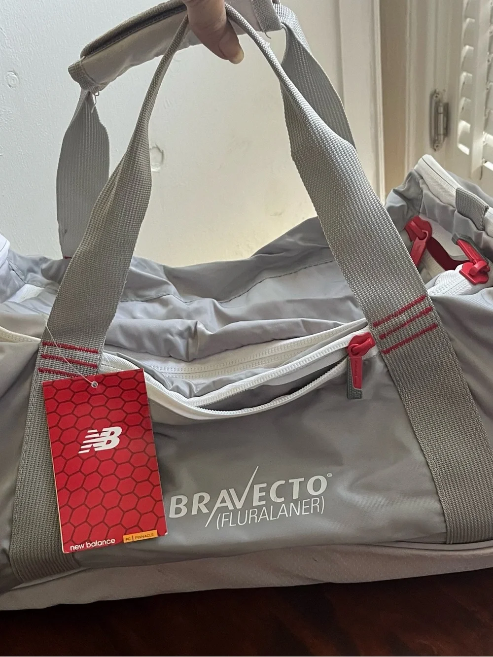 New Balance Gray and Red Bravecto Duffel Bag